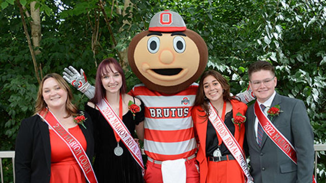 the homecoming court posing with brutus buckeye
